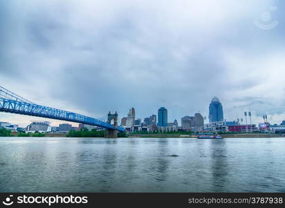 Cincinnati skyline. Image of Cincinnati skyline and historic John A. Roebling suspension bridge cross Ohio River.