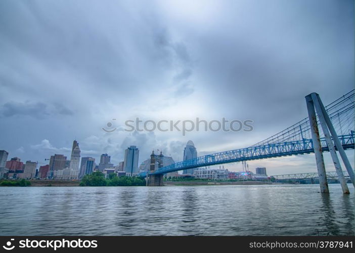 Cincinnati skyline. Image of Cincinnati skyline and historic John A. Roebling suspension bridge cross Ohio River.