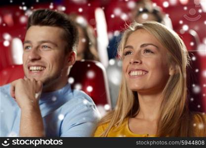 cinema, entertainment and people concept - happy couple watching movie in theater