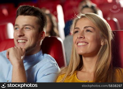 cinema, entertainment and people concept - happy friends watching movie in theater