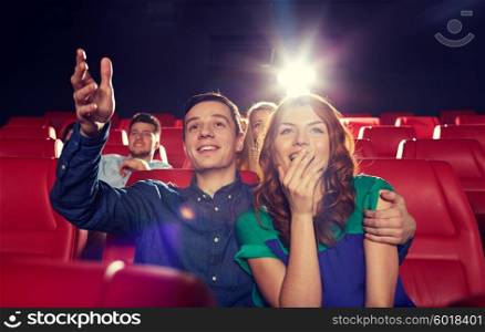 cinema, entertainment and people concept - happy friends watching movie in theater