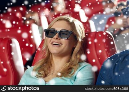 cinema, entertainment, technology and people concept - happy young woman in 3d glasses watching comedy and laughing in movie theater over snowflakes