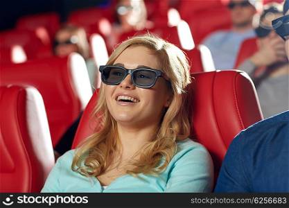 cinema, entertainment, technology and people concept - happy young woman in 3d glasses watching comedy and laughing in movie theater