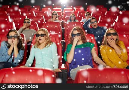 cinema, technology, entertainment and people concept - friends with 3d glasses watching horror or thriller movie in theater over snowflakes