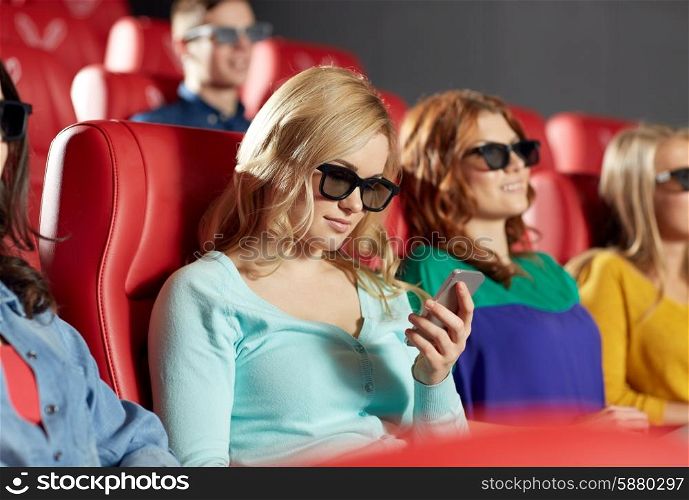 cinema, technology, entertainment and people concept - happy woman with 3d glasses and smartphone reading message in movie theater