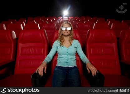 cinema, technology, entertainment and people concept - young woman with 3d glasses watching movie alone in empty theater auditorium