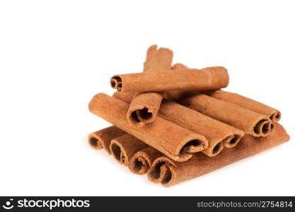 Cinnamon. A heap of sticks of cinnamon on a white background