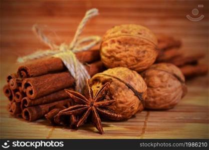 Cinnamon and star anise on a wooden background. Beautiful and fragrant spices for Christmas time and winter cooking season.