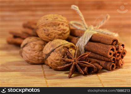 Cinnamon and star anise on a wooden background. Beautiful and fragrant spices for Christmas time and winter cooking season.