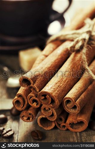 cinnamon, coffee and spices on wooden table