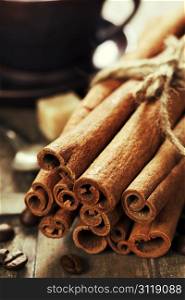 cinnamon, coffee and spices on wooden table