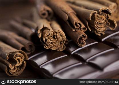 Cinnamon, Dark chocolate with candy sweet. Dark chocolate with candy sweet, dessert food, cinnamon