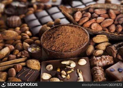 Cinnamon, Dark chocolate with milk and candy sweet. Chocolate sweet, cocoa and food dessert background