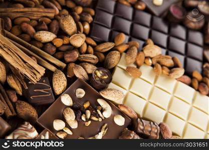 Cinnamon, Dark chocolate with milk and candy sweet. Chocolate sweet, cocoa and food dessert background