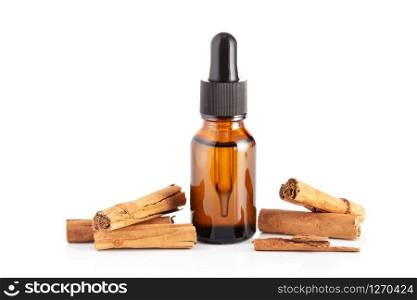 Cinnamon essential oil isolated on white background. Cinnamon oil for Cosmetic or beauty care