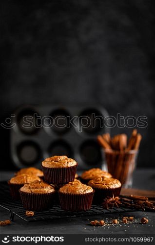 Cinnamon muffins on black background