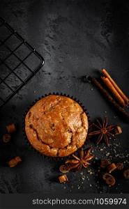 Cinnamon muffins on black background