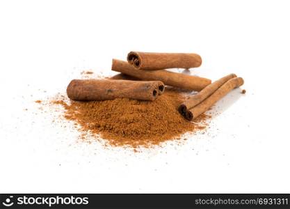 cinnamon powder with sticks isolated on a white background