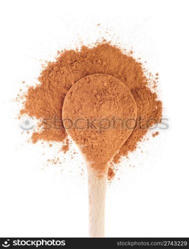 cinnamon spice on a wooden spoon, isolated on white background