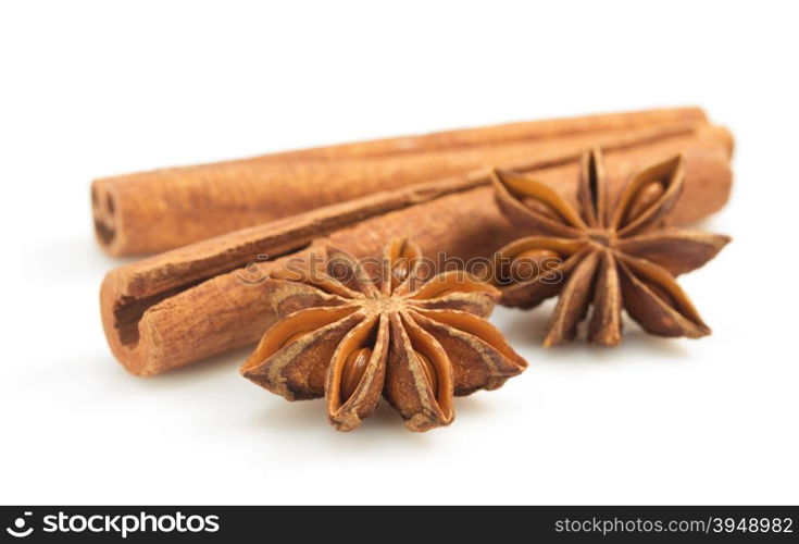 cinnamon sticks and anise star on white background