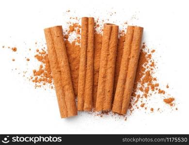 Cinnamon sticks and powder isolated on white background. Flat lay. Top view