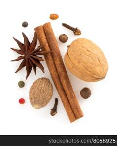 cinnamon sticks, anise star and nutmeg on white background