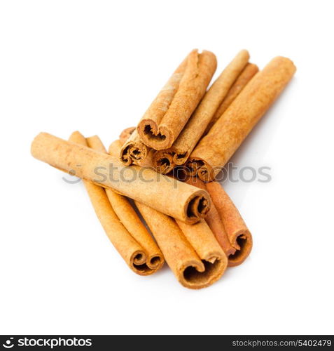 Cinnamon sticks close up isolated on white