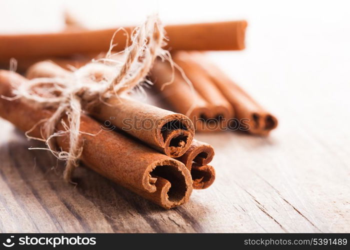 Cinnamon sticks close up on wooden table