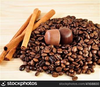 cinnamon sticks ,coffee beans and candy , close up