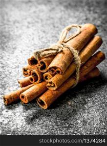 Cinnamon sticks. On a rustic background . Cinnamon spice sticks.