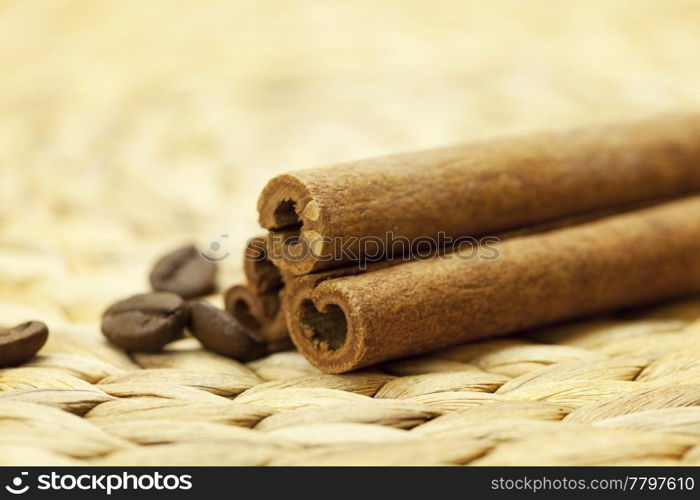 cinnamon sticks on a wicker mat