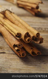 cinnamon sticks on wooden background