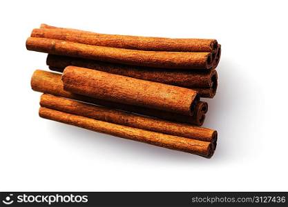 Cinnamon sticks over white background