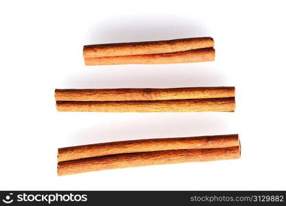 Cinnamon sticks over white background