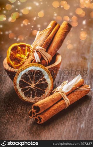 Cinnamon sticks with decoration on a wooden surface
