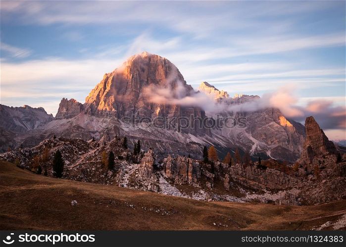 Cinque torri mountain peak panorama at cloudy sunset, Dolomites Alps, Italy. Cinque torri mountain peak panorama at cloudy sunset