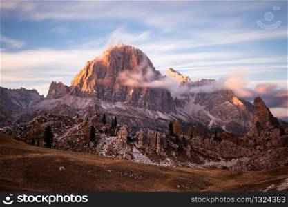 Cinque torri mountain peak panorama at cloudy sunset, Dolomites Alps, Italy. Cinque torri mountain peak panorama at cloudy sunset
