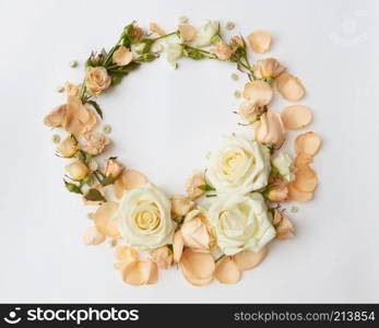 Circle of roses represented over white background. Beautiful ornament of roses may be used as post card in Valentine&rsquo;s Day or for wedding car of young romantic couple.. Roses on white background