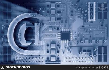 Circuit board blue background. E-mail sign on a blue printed circuit board for electronic components