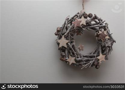 Circular Branches Woven: Christmas Decoration with Wooden Star and Little Pine Cones. Circular Branches Woven: Christmas Decoration with Wooden Star and Little Pine Cones.. Circular Branches Woven: Christmas Decoration with Wooden Star and Little Pine Cones