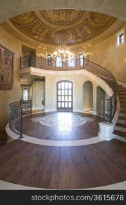 Circular entrance hallway and staircase with handrail Palm Springs