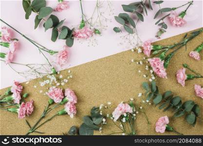 circular frame made with gypsophila pink carnation flowers dual pink cardboard backdrop
