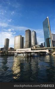 Circular Quay Railway Station in Sydney Cove with view of downtown skyscrapers in Sydney, Australia.