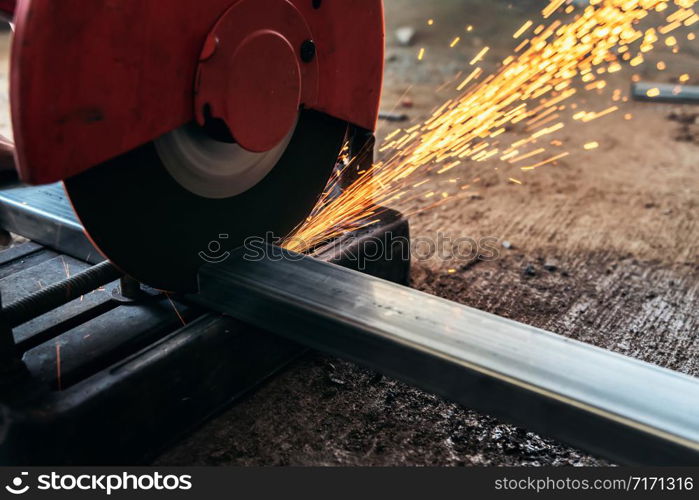 Circular saw cutting steel in construction site