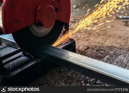 Circular saw cutting steel in construction site