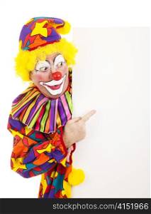 Circus clown pointing at a blank white space. Isolated design element.