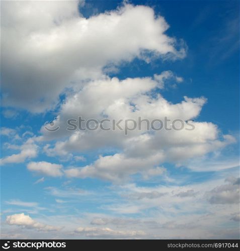 Cirrus clouds in the blue sky. Beautiful natural background.