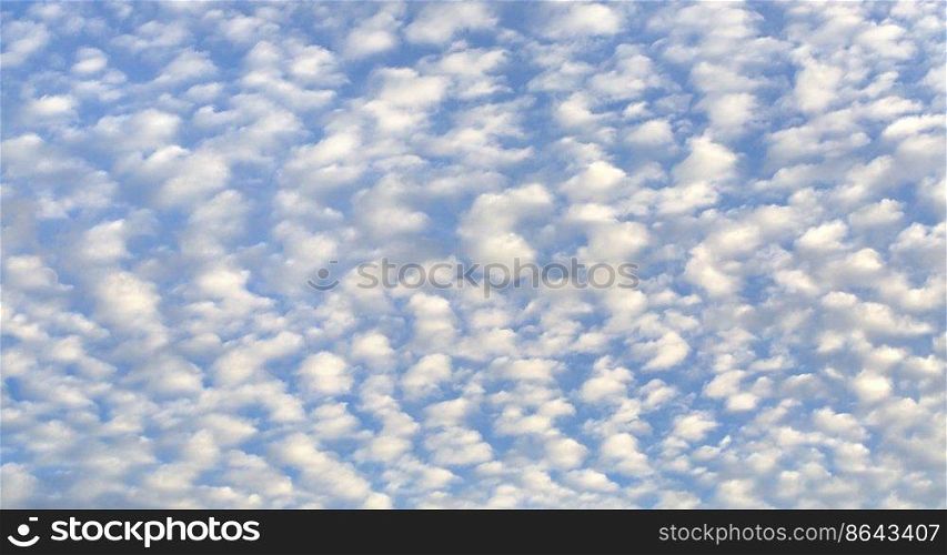 Cirrus-cumulus clouds. Autumn or summer blue sky with clouds during the day. Cloud cove