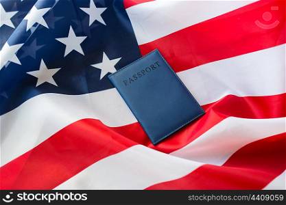 citizenship, patriotism and nationalism concept - close up of american flag and passport