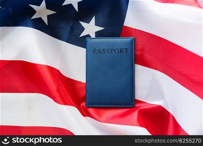 citizenship, patriotism and nationalism concept - close up of american flag and passport